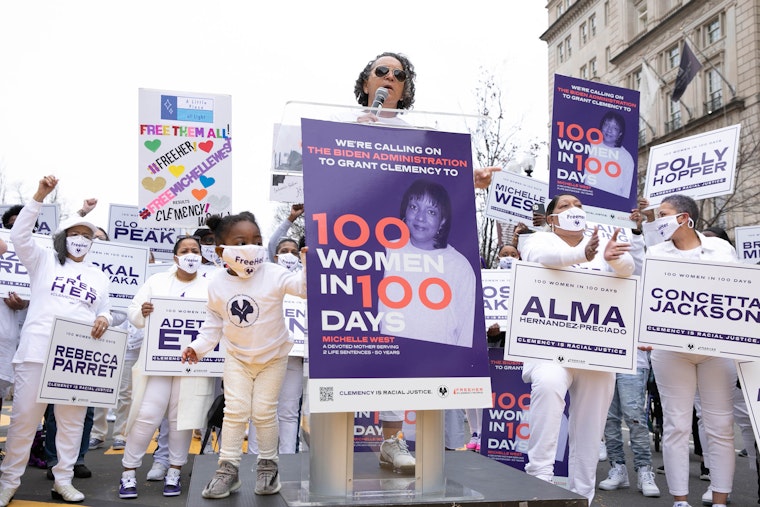 Andrea James speaks at a rally for The National Council for Incarcerated Women and Girls in Washington, DC., on March 12, 2021. © Brian Stukes/WireImage/Getty A group of protestors marching in the street